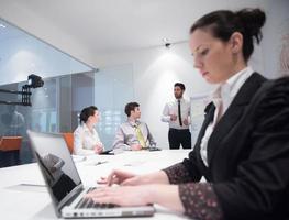 young business woman on meeting  using laptop computer photo