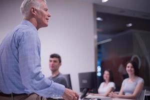 teacher and students in computer lab classroom photo