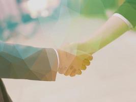 businesswoman and businessman handshake photo