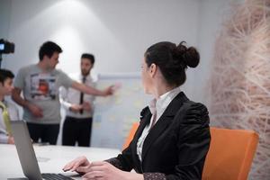 young business woman on meeting  using laptop computer photo