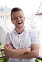 man standing at balcony photo