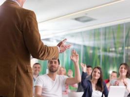 close up of teacher hand while teaching in classroom photo