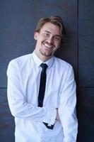 portrait of startup businessman in a white shirt with a tie photo