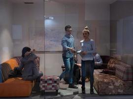 software developers sleeping on sofa in creative startup office photo