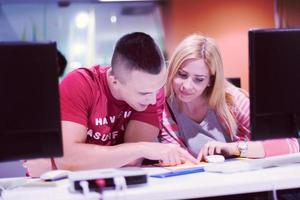 technology students group working  in computer lab school  classroom photo