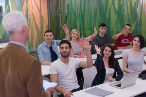 teacher with a group of students in classroom photo