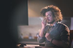 businessman relaxing at the desk photo