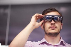 man using virtual reality gadget computer glasses photo