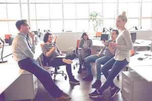 Young Business Team At A Meeting at modern office building photo