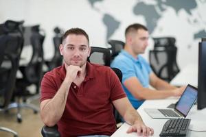 two male software developers working on computer photo