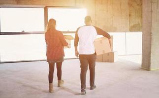 multiethnic business team carrying cardboard boxes photo