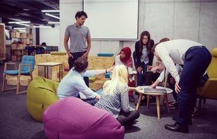Multiethnic startup business team having meeting photo