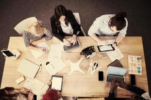 top view of multiethnic business team learning about drone technology photo