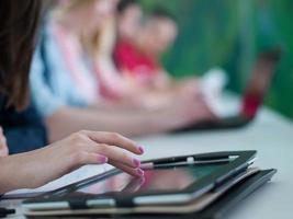 group of students study together in classroom photo