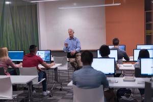 teacher and students in computer lab classroom photo