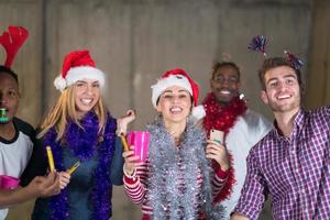 multiethnic group of casual business people dancing with sparklers photo