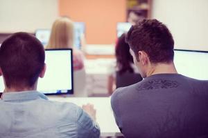 technology students group working  in computer lab school  classroom photo