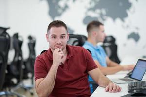 two male software developers working on computer photo