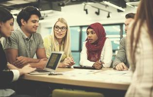 Multiethnic startup business team having meeting photo