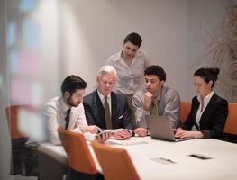 business people group on meeting at modern startup office photo