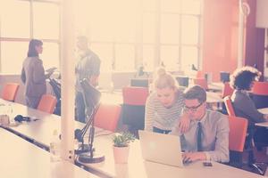 Two Business People Working With laptop in office photo