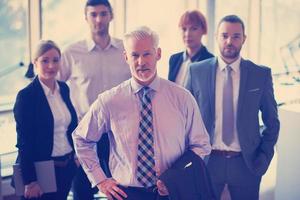 senior business man with his team at office photo