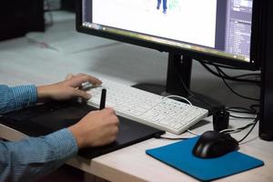 photo editor at his desk