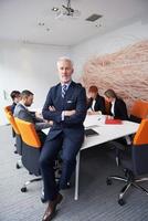 senior business man with his team at office photo