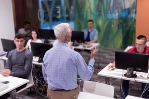 teacher and students in computer lab classroom photo