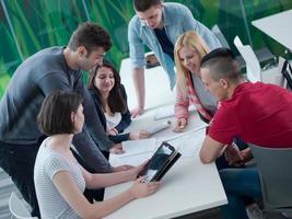 group of students study together in classroom photo