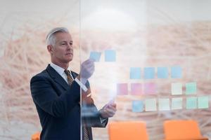 senior business man making plans with sticker photo