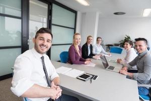 young business people group on team meeting at modern office photo