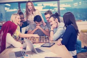 multiethnic group of business people playing chess photo