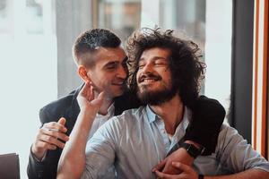 Diverse friends gay couple hugging. Stylish cool generation z men dating in love enjoy romantic relationships photo