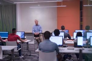 teacher and students in computer lab classroom photo