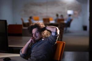 businessman relaxing at the desk photo