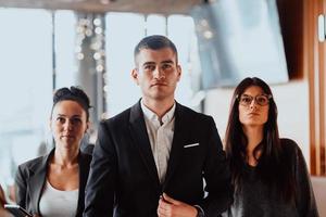 Group of successful business people standing together at office. photo