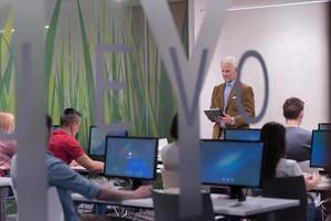 teacher and students in computer lab classroom photo