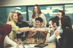 multiethnic group of business people playing chess photo