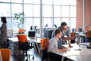 Two Business People Working With computer in office photo