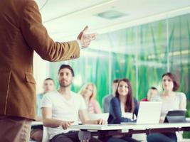 close up of teacher hand while teaching in classroom photo