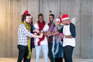 multiethnic group of casual business people lighting a sparkler photo