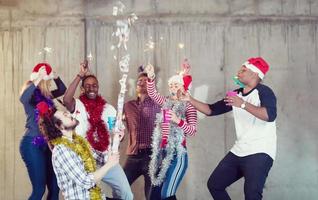 multiethnic group of casual business people having confetti party photo