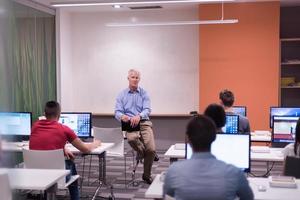 teacher and students in computer lab classroom photo