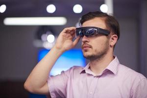 man using virtual reality gadget computer glasses photo