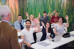 teacher with a group of students in classroom photo