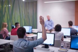 student answering a question in classroom photo