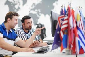 two male software developers working on computer photo