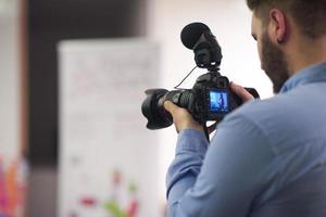 videographer recording on conference photo