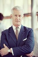 portrait of handsome senior business man at modern office photo